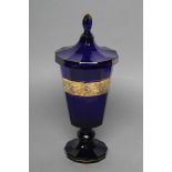 A MOSER KARLSBAD BLUE GLASS GOBLET AND COVER, 1930'S, the panelled flared bowl acid etched and