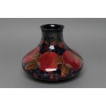 A MOORCROFT POTTERY POMEGRANATE PATTERN VASE, early 20th century, of squat baluster form,