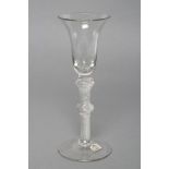 A WINE GLASS, mid 18th century, the bell bowl on multi air twist knopped stem and conical foot, 6