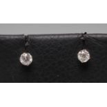 A PAIR OF SOLITAIRE DIAMOND EAR STUDS, each claw set round brilliant of approximately 0.12cts, to