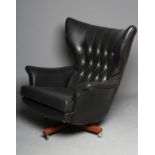A G PLAN MODEL 6250 "BLOFELD" WING ARMCHAIR, designed by Paul Conti, button upholstered in black