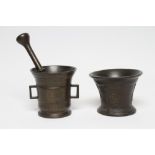 A BRONZE MORTAR, 17th century, with flared and moulded rim, the body cast with crowned roses, on