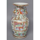 A CANTONESE PORCELAIN VASE of baluster form with salamander shoulders and shi-shi handles, painted