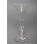 A WINE GLASS, late 18th century, the drawn trumpet bowl engraved with fruiting vine, on a multi-