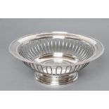 A SILVER BREAD BASKET, maker Reid & Sons, London 1919, of circular form with straight gadrooned rim,