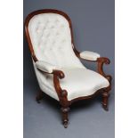 A VICTORIAN MAHOGANY ARMCHAIR button upholstered in an ivory weave, arched back, open padded arms