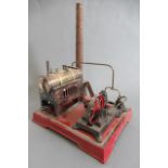 Twin cylinder stationary spirit fired steam engine, brick effect, boiler housing and chimney, some