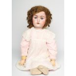 A J. D. Kestner bisque socket head doll, with blue glass sleeping eyes, open mouth, applied teeth,