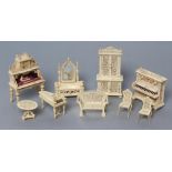 A collection of Victorian bone and ivory doll's house furniture, all with pierced design