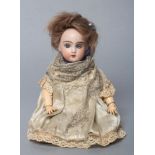 A possible Tete Jumeau bisque socket head doll, with blue glass fixed eyes, open mouth, teeth,
