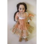 An A. Lanternier & Cie bisque socket head doll, with fixed blue paperweight eyes, open mouth, six