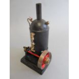 Small vertical spirit fired steam engine, single cylinder, domed boiler, with water gauge, on cast