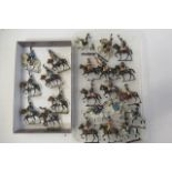 Twenty two Napoleonic mounted soldiers of unknown make, solid cast figure, 80mm including horse,