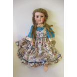 A German bisque socket head doll, with brown glass sleeping eyes, open mouth and teeth, wood and