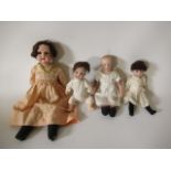 Four bisque head dolls, comprising a 9" Heubach 5/0 solemn boy, a 14" Armand Marseille 370 7/0