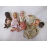 A quantity of dolls and doll parts, including an Armand Marseille 341/4k black baby doll and an