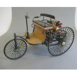 A 1:8 scale model of the Mercedes tricycle car, plastic and metal construction, fuel tank loose, F-G