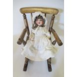 An Armand Marseille bisque socket head character doll, with blue glass sleeping eyes, open mouth,