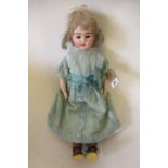 A possibly Kestner shoulder head doll, with brown glass fixed eyes, open mouth, six top teeth,