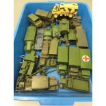 Twenty six army vehicles by Dinky and others including trucks, field guns and armoured cars, some