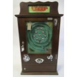 A nine cup slot machine, wooden cabinet with chrome mechanism, 10p slot with keys, G-E (Est. plus