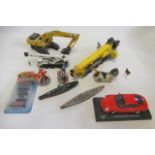 Mixed playworn toys including construction vehicles, cars, wagon, donkey, cat and battleship, some