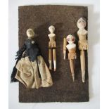 A family of Victorian miniature Grodenthal wooden dolls, with painted faces and one in a original