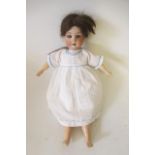 A Gebruder Heubach bisque socket head lady doll, with blue glass sleeping eyes, open mouth and