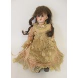 A French bisque socket head walking doll, with brown glass fixed eyes, open mouth, teeth, pierced