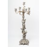 A LARGE FIGURAL SIX BRANCH SEVEN LIGHT TABLE CANDELABRUM, the lobed sockets with rococo drip pans on