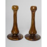 A PAIR OF BURMANTOFTS FAIENCE ART NOUVEAU CANDLESTICKS, early 20th century, the garlic neck