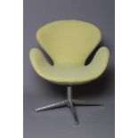 A FRITZ HANSEN TYPE SWAN CHAIR by Arne Jacobson, modern, upholstered in a lime green wool fabric, on