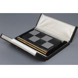 A LIMITED EDITION SILVER TRAVELLING CHESS SET, maker Cyril Endfield, London 1972, commemorating