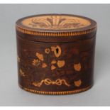 A REGENCY MAHOGANY TEA CADDY of oval form with ribbon tied marquetry flowers and berried branches,