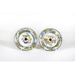 A PAIR OF CANTON ENAMEL SAUCERS of plain circular form, one centrally painted with a flowering
