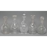TWO VICTORIAN GLASS TRIPLE RING NECK MALLET DECANTERS AND STOPPERS with panelled shoulders and