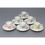 A SET OF FOUR ROYAL WORCESTER CHINA COFFEE CANS AND SAUCERS, 1936, all painted in polychrome enamels