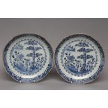 A PAIR OF CHINESE PORCELAIN DISHES of rounded octagonal form, painted in underglaze blue with bamboo