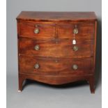 A GEORGIAN MAHOGANY BOWED CHEST, late 18th century, the banded and string inlaid top over two