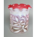 A LATE VICTORIAN SHADED CRANBERRY GLASS SHADE of cylindrical form with frilled rim and white