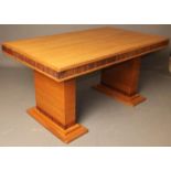 AN ART DECO TABLE veneered in American white ash and with zebra wood banding, the oblong top with