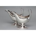 A PAIR OF SILVER PEDESTAL SAUCEBOATS, maker Roberts & Belk, Sheffield 1933, of oval form with