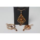 THREE EDWARDIAN OPEN SHIELD PENDANTS, two set with citrines, one with almandine garnets, all with