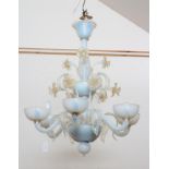 A VENETIAN SIX LIGHT CHANDELIER, 20th century, in Latticino blue and opaque glass, the baluster stem