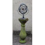 A BRONZED METAL ARMILLARY SPHERE on turned baluster stem and circular base, 20 3/4" high, mounted on