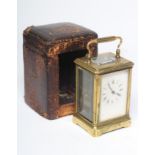 A BRASS CASED CARRIAGE CLOCK, the twin barrel movement with platform escapement striking on a