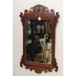 A MAHOGANY FRET FRAMED MIRROR, early 19th century, the oblong plate within a moulded frame with gilt