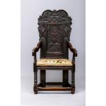 A JOINED OAK ARMCHAIR, Leeds Yorkshire, mid/late 17th century, the arched top rail carved with