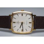 A GENTLEMAN'S OMEGA WRISTWATCH, the rounded square matt silvered dial with applied gilt metal
