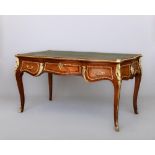 A LOUIS XV STYLE KINGWOOD BUREAU PLAT, 20th century, of serpentine outline with inset green
